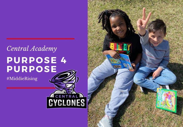 Two young students reading outside